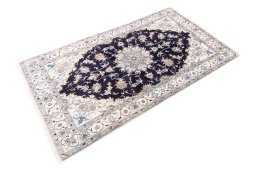 Close-up detail of 2005s Nain rug from Iran / Persia showing Wool weave