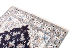Surface texture of 2005s Nain rug with natural Wool and intricate pattern