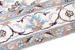Backside of handmade 2005s Nain rug showing knot structure and weave density