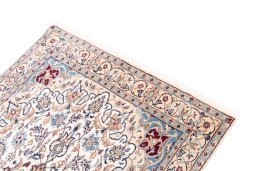 Surface texture of 2005s Nain rug with natural Wool and intricate pattern