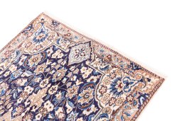 Surface texture of 1988s Nain rug with natural Wool and intricate pattern