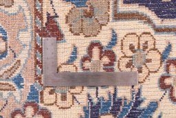 Corner detail of 1988s Nain rug showing border pattern and Wool pile