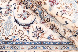 Corner detail of 1987s Nain rug showing border pattern and Wool pile