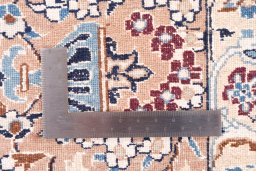 Surface texture of 2005s Nain rug with natural Wool and intricate pattern
