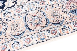 Backside of handmade 2005s Nain rug showing knot structure and weave density