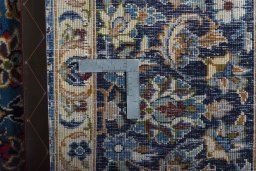 Backside of handmade 2000s Najafabad rug showing knot structure and weave density