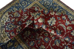 Surface texture of 2000s Najafabad rug with natural Wool and intricate pattern