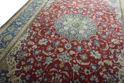 Backside of handmade 2000s Najafabad rug showing knot structure and weave density