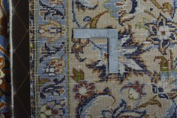 Backside of handmade 2000s Najafabad rug showing knot structure and weave density