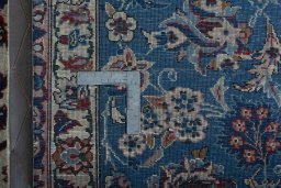 Backside of handmade 2000s Najafabad rug showing knot structure and weave density