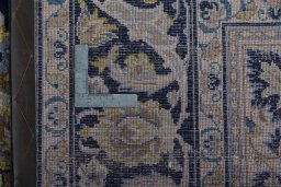 Backside of handmade 2000s Najafabad rug showing knot structure and weave density