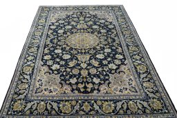 Surface texture of 2000s Najafabad rug with natural Wool and intricate pattern