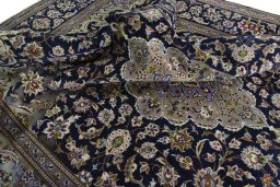 Surface texture of 2000s Najafabad rug with natural Wool and intricate pattern