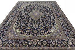 Surface texture of 2000s Najafabad rug with natural Wool and intricate pattern