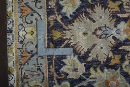 Backside of handmade 2000s Najafabad rug showing knot structure and weave density
