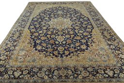 Surface texture of 2000s Najafabad rug with natural Wool and intricate pattern