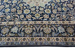 Corner detail of 2000s Najafabad rug showing border pattern and Wool pile