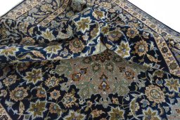 Surface texture of 2000s Najafabad rug with natural Wool and intricate pattern