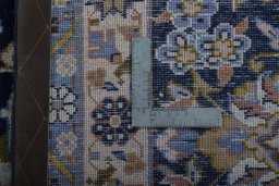 Backside of handmade 2000s Najafabad rug showing knot structure and weave density