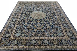 Surface texture of 2000s Najafabad rug with natural Wool and intricate pattern