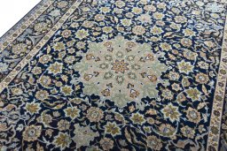 Backside of handmade 2000s Najafabad rug showing knot structure and weave density