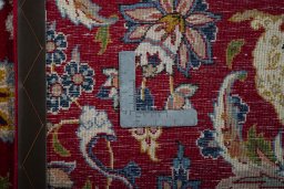 Backside of handmade 2000s Najafabad rug showing knot structure and weave density