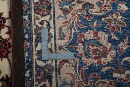 Backside of handmade 1950s Najafabad rug showing knot structure and weave density