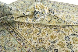 Surface texture of 2000s Najafabad rug with natural Wool and intricate pattern
