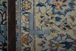 Backside of handmade 2000s Najafabad rug showing knot structure and weave density