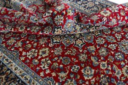 Surface texture of 2000s Najafabad rug with natural Wool and intricate pattern