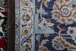 Backside of handmade 2000s Najafabad rug showing knot structure and weave density