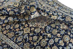 Surface texture of 2000s Najafabad rug with natural Wool and intricate pattern