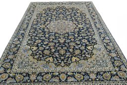 Surface texture of 2000s Najafabad rug with natural Wool and intricate pattern