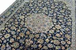 Backside of handmade 2000s Najafabad rug showing knot structure and weave density