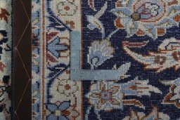 Backside of handmade 2000s Najafabad rug showing knot structure and weave density