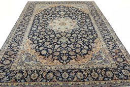 Surface texture of 2000s Najafabad rug with natural Wool and intricate pattern