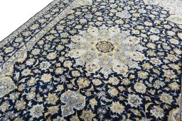 Backside of handmade New Najafabad rug showing knot structure and weave density