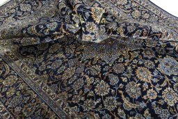 Surface texture of 2000s Najafabad rug with natural Wool and intricate pattern