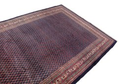 Surface texture of 1960s Sarough rug with natural Wool and intricate pattern