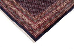 Backside of handmade 1960s Sarough rug showing knot structure and weave density