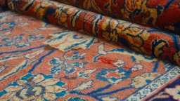 Backside of handmade New Sarough rug showing knot structure and weave density