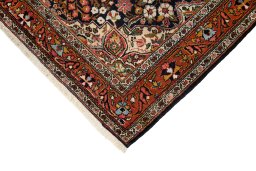 Backside of handmade 1930s Sarough rug showing knot structure and weave density