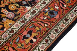 Close-up detail of 1930s Sarough rug from Iran / Persia showing Wool weave