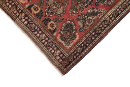 Backside of handmade 1950s Sarough rug showing knot structure and weave density