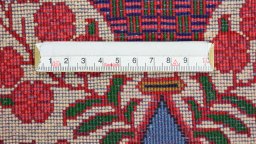 Backside of handmade 1950s Sarough rug showing knot structure and weave density