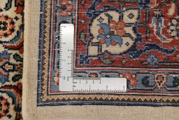 Backside of handmade New Sarough rug showing knot structure and weave density