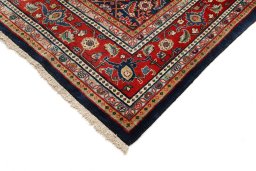 Backside of handmade 1950s Sarough rug showing knot structure and weave density