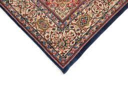 Backside of handmade 1950s Sarough rug showing knot structure and weave density