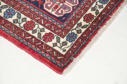 Surface texture of 2000s Sarough rug with natural Wool and intricate pattern