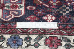 Backside of handmade 2000s Sarough rug showing knot structure and weave density